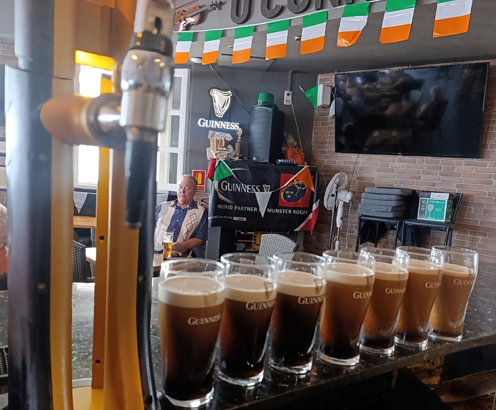 Pints of Guinness settling on the bar at O'Connor's, Playa Blanca