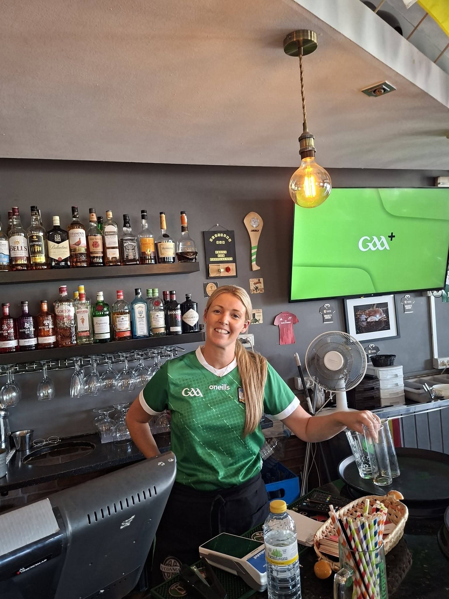 Laura behind the bar on GAA match day at O'Connor's, Playa Blanca